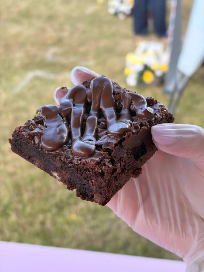 A chocolate brownie with a ganache drizzle